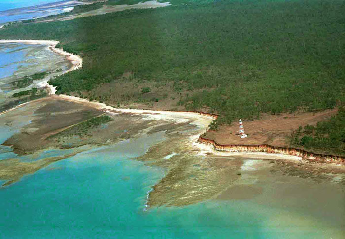 A narrow high tide beach backed by laterite bluffs and fronted by irregular intertidal laterite (rock) flats at Charles Point, near Darwin, Northern Territory. (Photo: A D Short).